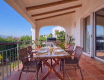 a dining room table in front of a building a dining room table in front of a building